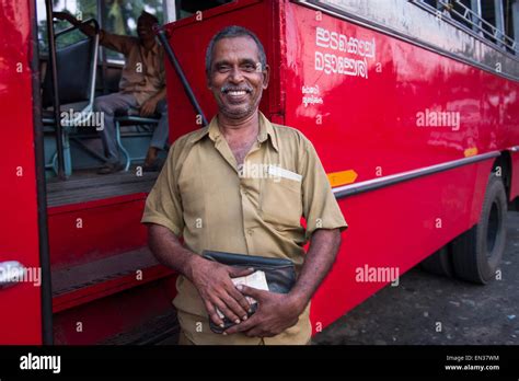 Bus driver in front of a red bus, Kerala, India Stock Photo - Alamy