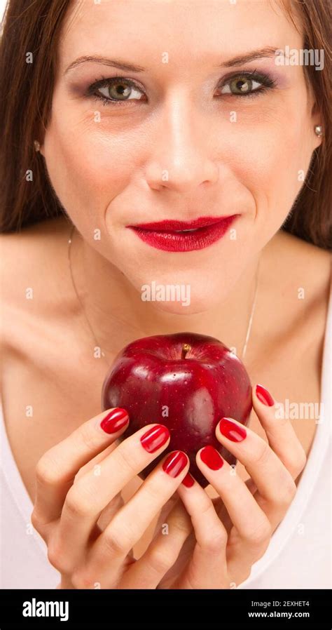 Manicured Female Hands Holding Red Delicious Apple Stock Photo - Alamy