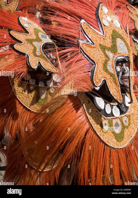 Orange masked dancers at the colorful Ati Atihan Festival Philippines ...