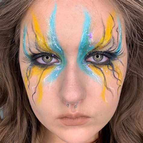 Cian blue & yellow makeup