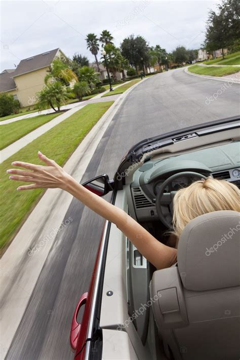 Young Woman Driving Convertible Car With Hand In The Air — Stock Photo ...