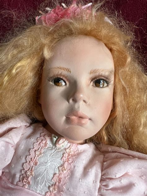She is a beautiful caucasian doll with flowing wavy red hair and brown ...