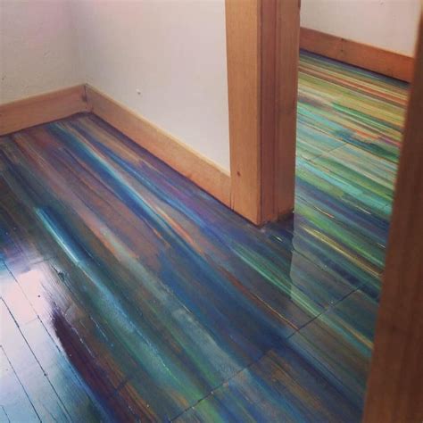 I painted an old wood floor covered in old varnish with acrylic paint on a rag, and then covered ...