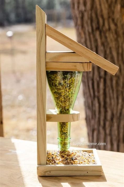 15 DIY Wine Bottle Bird Feeder Plans For Welcoming Birds - DIYS