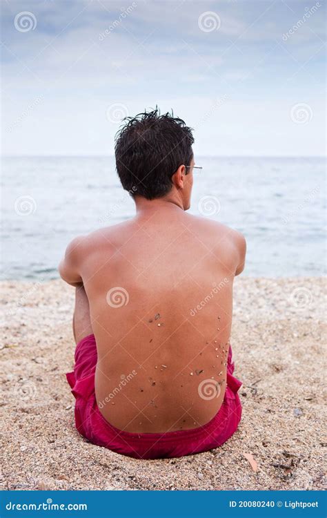 Young Man Sitting Alone on the Beach Stock Photo - Image of beach ...