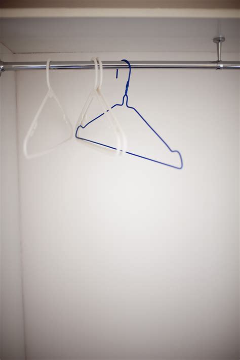 Free Image of Empty wire coat hangers in a closet | Freebie.Photography