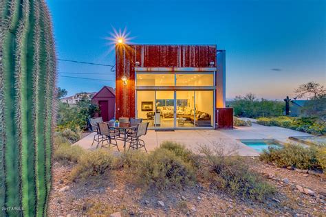 Clad in weathered corrugated steel, the compact home takes advantage of ...