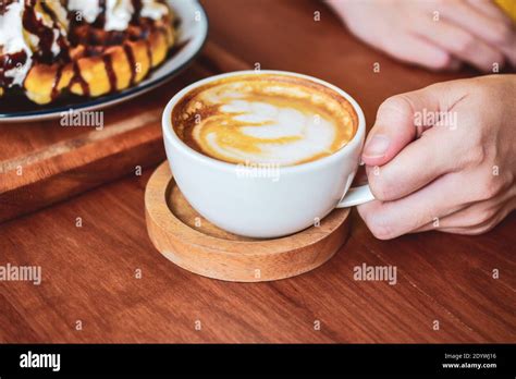 People Drinking Coffee Latte Stock Photo - Alamy