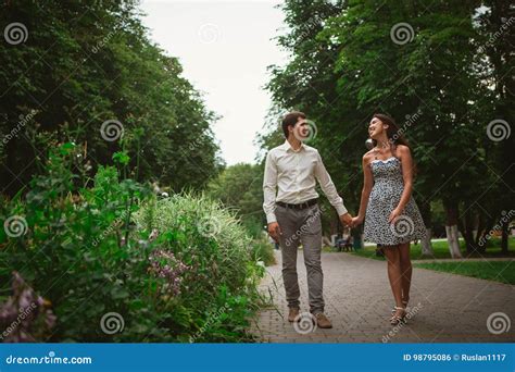 Beautiful Young Couple on a Nature Background Stock Photo - Image of girlfriend, background ...