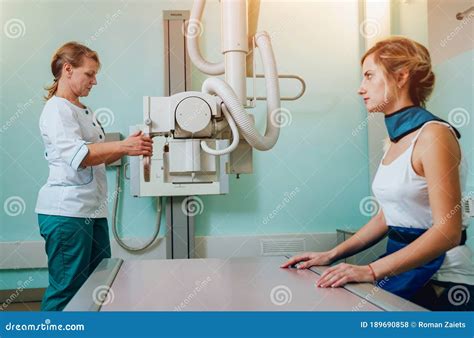 Radiologist and Patient in a X-ray Room. Classic Ceiling-mounted X-ray ...