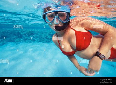 Egypt Red Sea Abu Kefan Reef woman in red bikini snorkeling Stock Photo ...