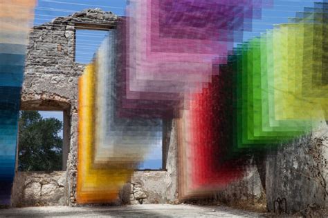 Quintessenz creates stunning rainbow installation of mesh material on the island of Paxos ...