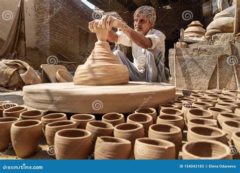 Indian Potter Making Clay Pots On Pottery Wheel In Bikaner. Rajasthan ...