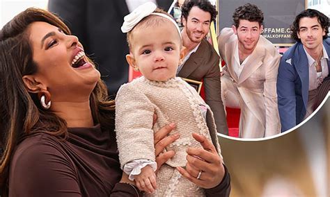 Nick Jonas' baby girl is seen for the FIRST TIME as he receives star on ...