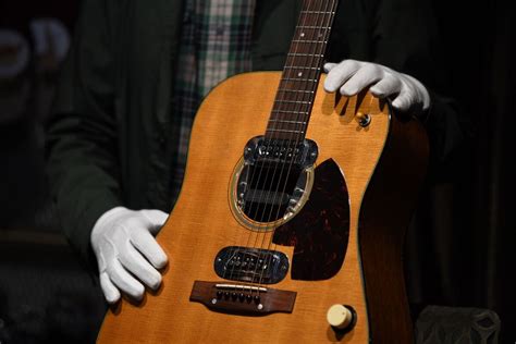 Kurt Cobain’s MTV ‘Unplugged’ Guitar Rakes in $6 Million - Bloomberg