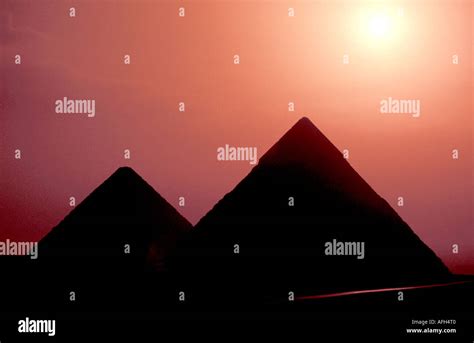 Egypt Giza two pyramids sunrise silhouette Stock Photo - Alamy