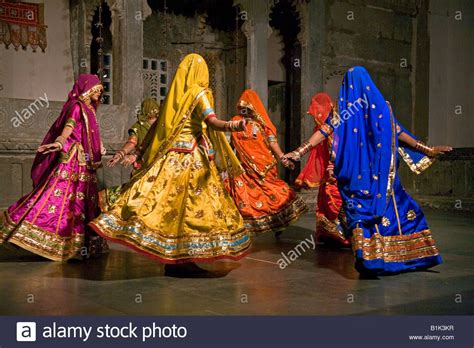 Rajasthani Women Perform A Traditional Dance In Their Colorful Silk ...