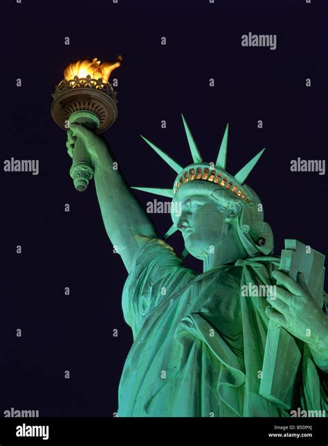 Close up of the Statue of Liberty illuminated at night in New York USA ...