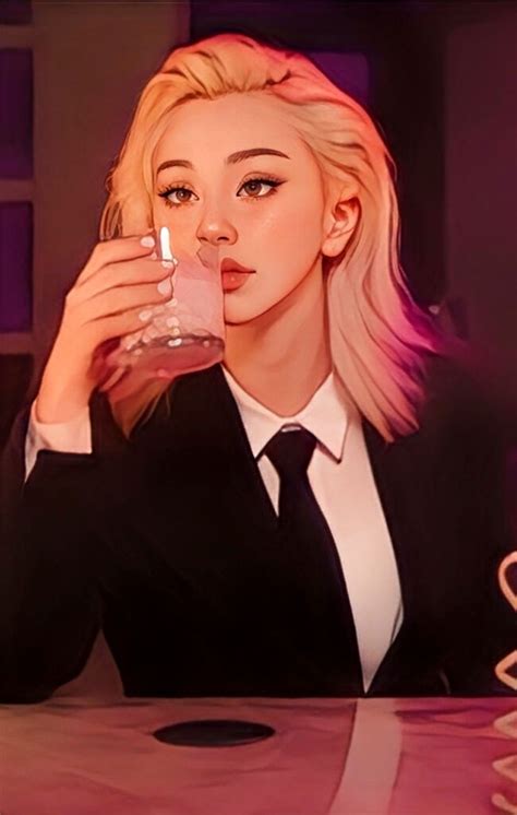 a woman sitting at a table with a drink in her hand and wearing a suit