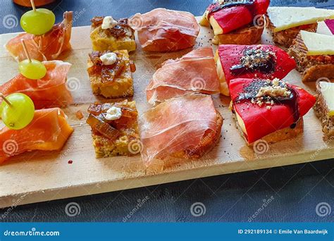 Wooden Plank with Five Varieties of Delicious Tapas or Bruschetta Stock Photo - Image of ...