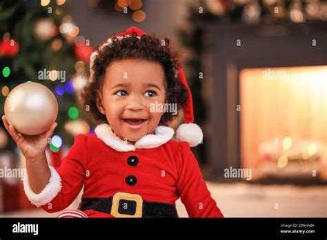 Cute African-American baby girl at home on Christmas eve Stock Photo - Alamy