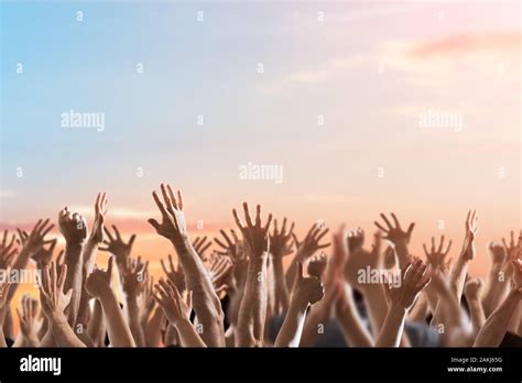 Crowd Of People Raising Hands At Celebration Event Stock Photo - Alamy