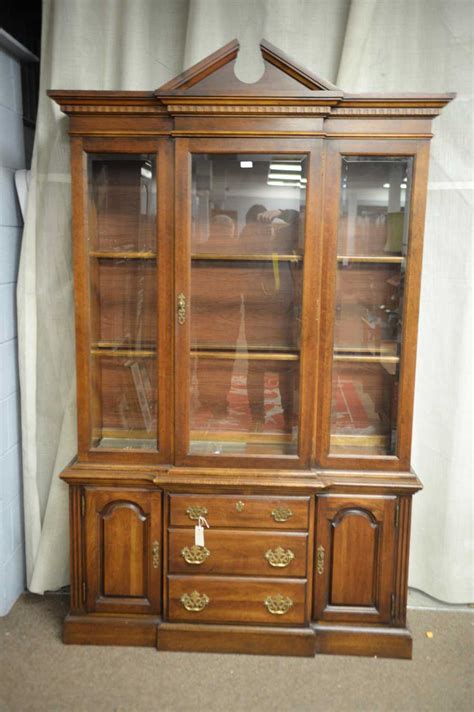 Lot 211 - A modern mahogany display cabinet.