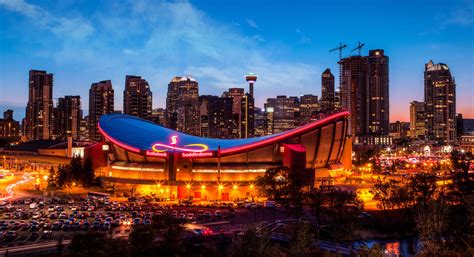 Panorama of Calgary City Downtown Skyline At Sunset Blue Hour - Stadium Parking Guides