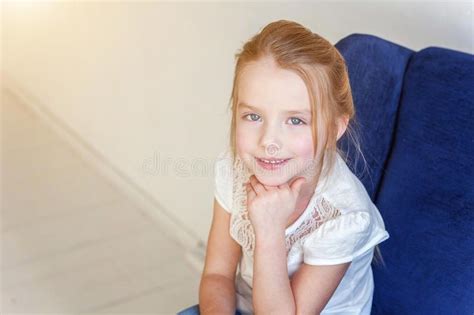 Girl on modern chair stock image. Image of funny, cute - 127410871