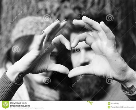 Couple in Love Shows Heart Sign with Fingers. Lovers Stock Image - Image of date, happy: 118149245