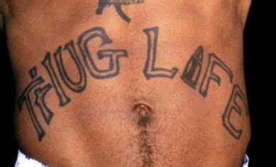A close up to Tupac's legendary "THUG LIFE" abdominal tattoo | Tupac, Tupac shakur, Tattoos