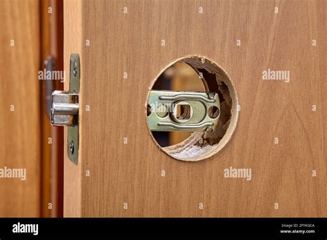 Inner part of door latch mechanism is at assembly stage Stock Photo - Alamy