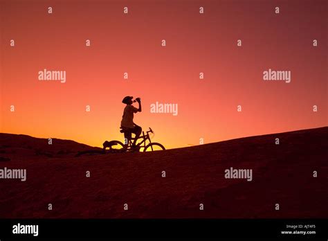 Silhouette person on bike Stock Photo - Alamy