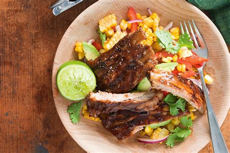 Ginger beer pork ribs with corn and avocado salad