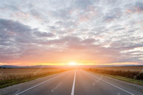 Premium Photo | Empty asphalt road in sunset time with magic sky