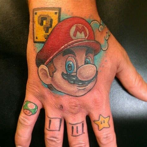 Pin by Deanna on Mario Tattoos | Mario tattoo, Knuckle tattoos, Hand ...