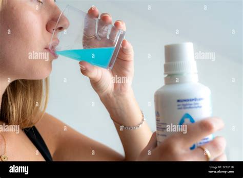 Bad breath, prevention through cleaning, mouth rinse Stock Photo - Alamy