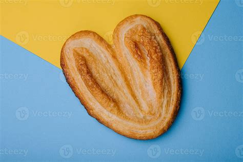 Puff pastry cookies on blue and yellow background 30515396 Stock Photo at Vecteezy