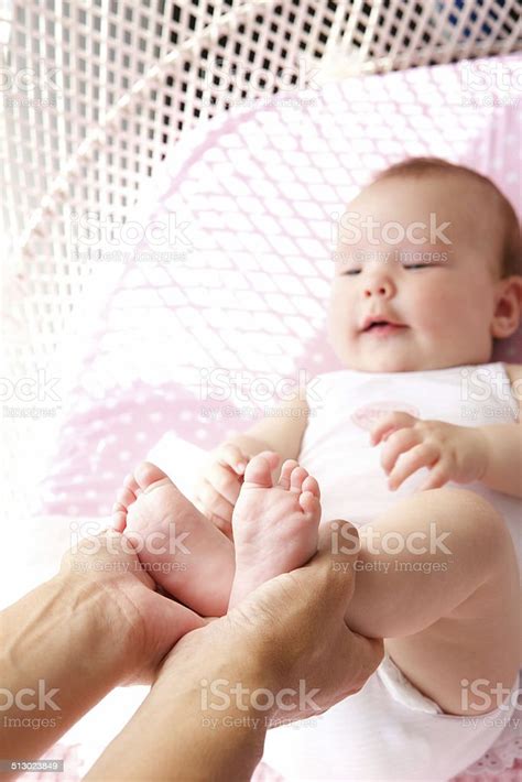Female Hands Holding Baby Feet Stock Photo - Download Image Now - 0-11 Months, 6-11 Months ...
