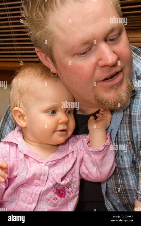 Father age 33 and baby daughter bonding at home. St Paul Minnesota MN USA Stock Photo - Alamy