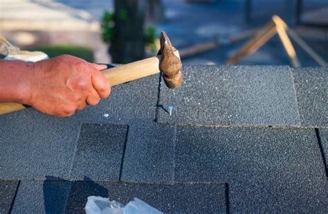 Contractor Repair Corner Bitumen Roof Shingles with Hammer and Nails Stock Photo - Image of ...