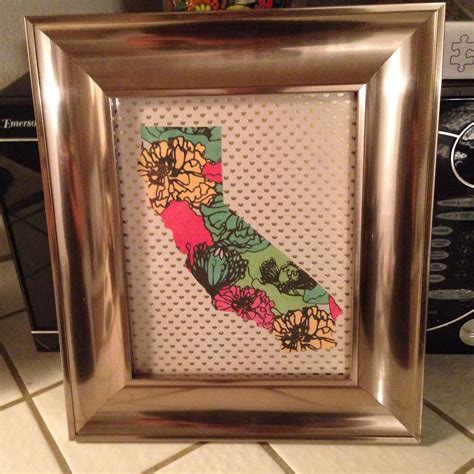 a picture frame with the shape of a california state map in florals on it