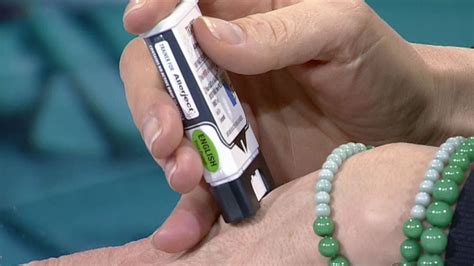 Nurse sets up easy access auto injectors to help with severe allergic ...