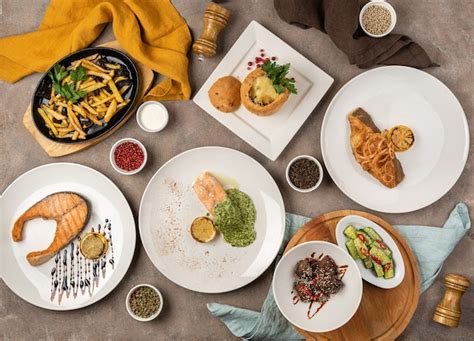 Premium Photo | Assortment of meat and fish dishes on the table