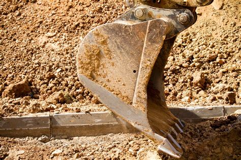 Premium Photo | Excavator digging a deep trench, working