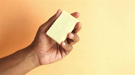 holding a natural soap bar against orange color background 36018985 Stock Video at Vecteezy