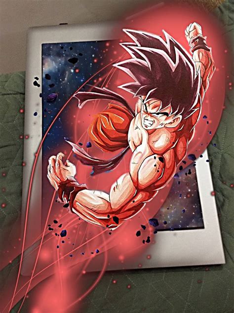 a drawing of gohan is displayed on a laptop screen, with the background painted red and blue
