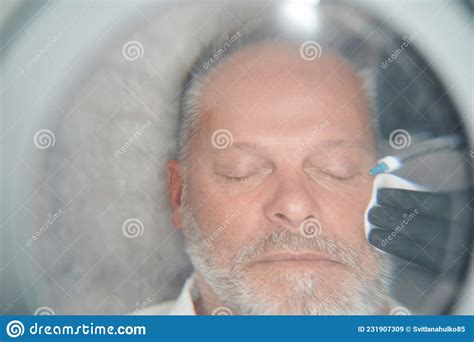 Man Getting Injection in Face in Cosmetology Clinic Stock Image - Image ...