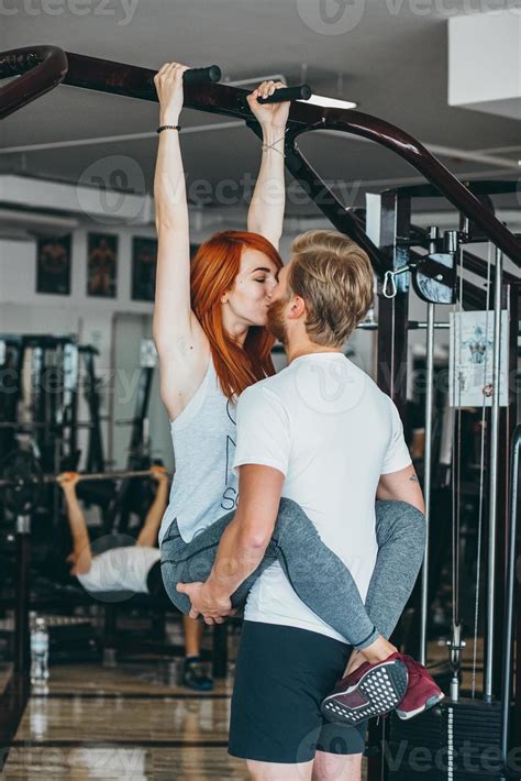 guy kiss girlfriend on training in gym 11531084 Stock Photo at Vecteezy