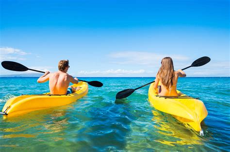 Man and Woman Kayaking in the Ocean - KayaKudos.com